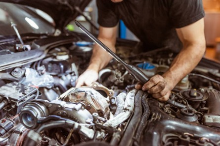 Technician repairing a turbo charger